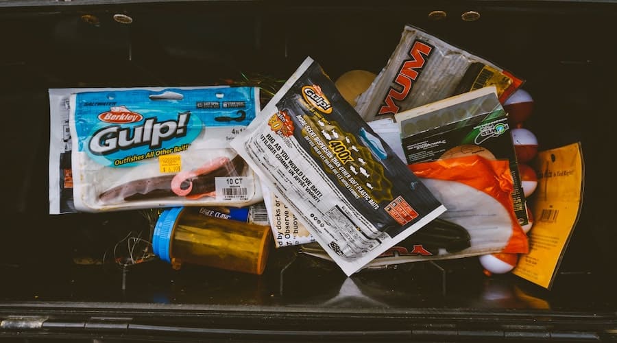Fishing gear stored inside of a tackle box. 